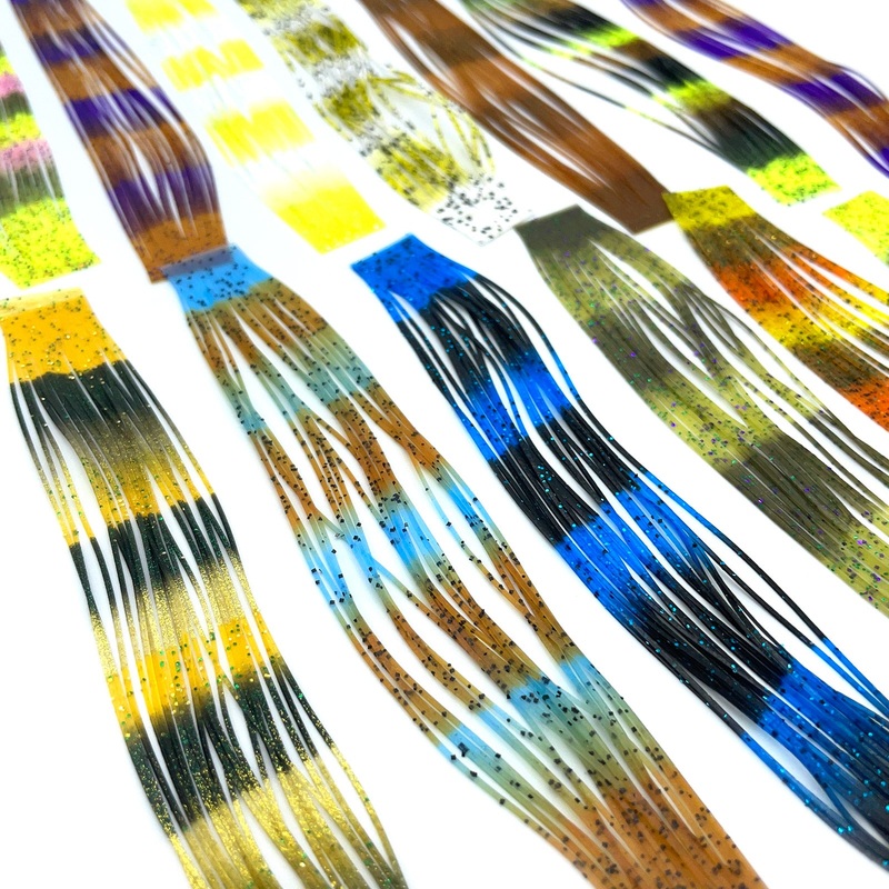 Hareline Fly Enhancer Legs|Blue / Black|Brown / Pumpkin|Chartreuse / Olive / Black|Gold / Amber / Black|Light Blue / Pumpkin|Olive / Light Olive|Orange / Pumpkin / Yellow|Pink / Olive / Fl. Yellow|Purple / Pumpkin|White / Chartreuse|Yellow / White Black S